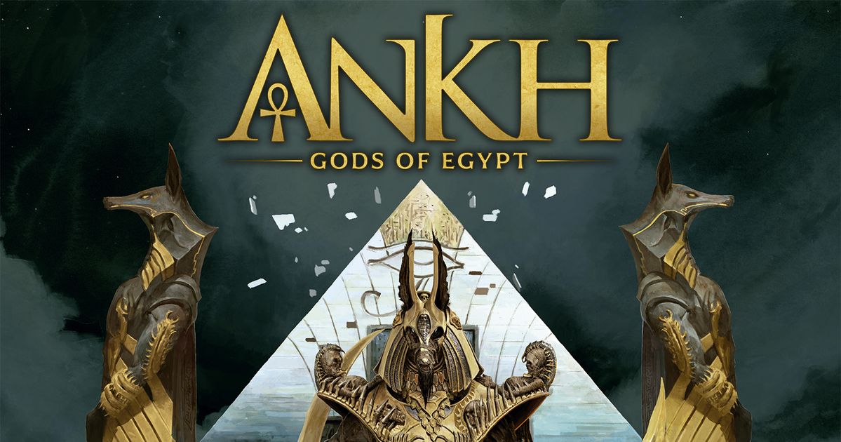 Box art for Ankh: Gods of Egypt, showing a golden Anubis-headed pyramid figure flanked by jackal statues under gold logo text